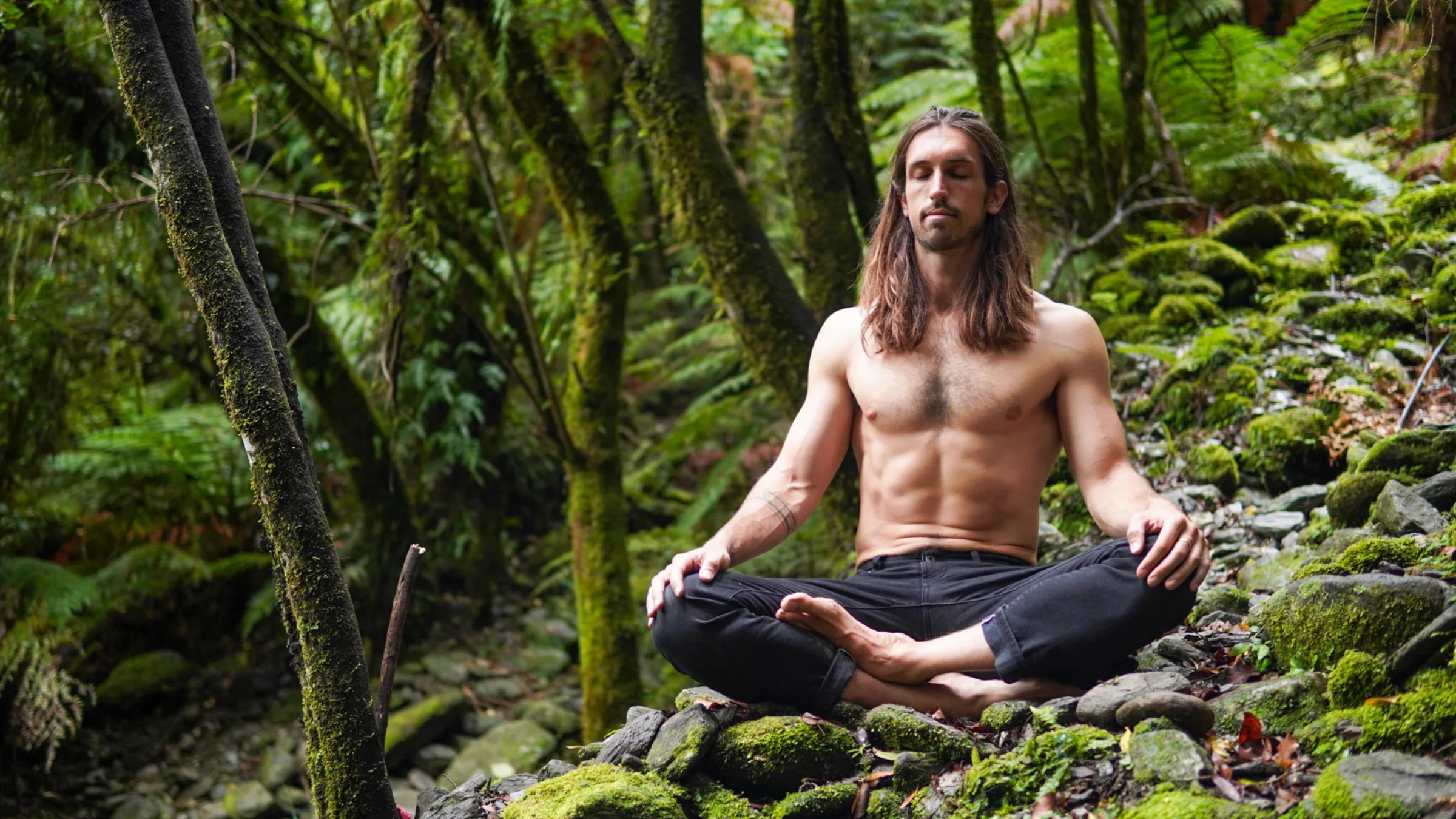 Sandy meditating outdoors